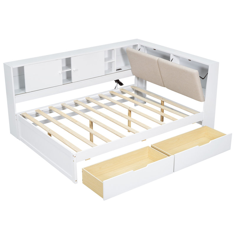 Lit de coin en bois en forme de L avec tiroirs sous le lit avec bibliothèque de rangement et tête de lit tapissier et ports de chargement USB pour un espace limité