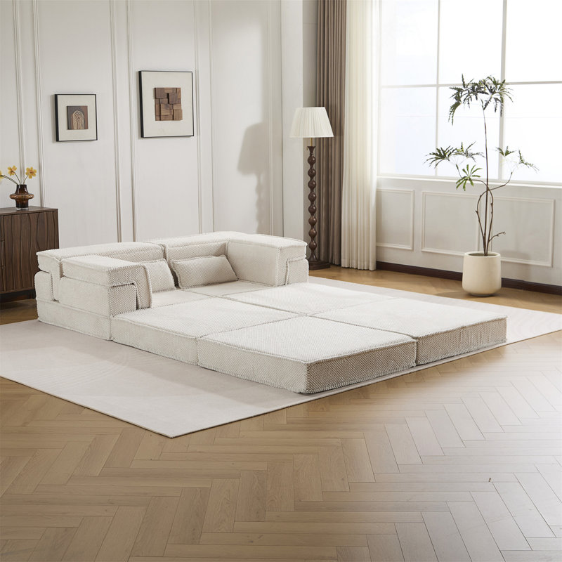 Canapé-lit convertible au sol avec conception modulaire, mousse à mémoire de forme haute densité et tissu facile à nettoyer pour une utilisation multifonctionnelle.