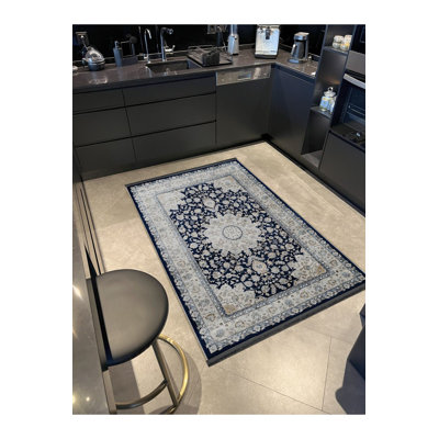 Tapis décoratif lavable à la machine dans des tons de bleu et beige