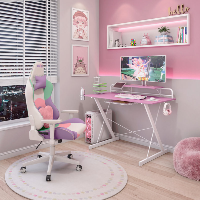 Bureau d'ordinateur rose avec tablette de jeu en carbone rose
