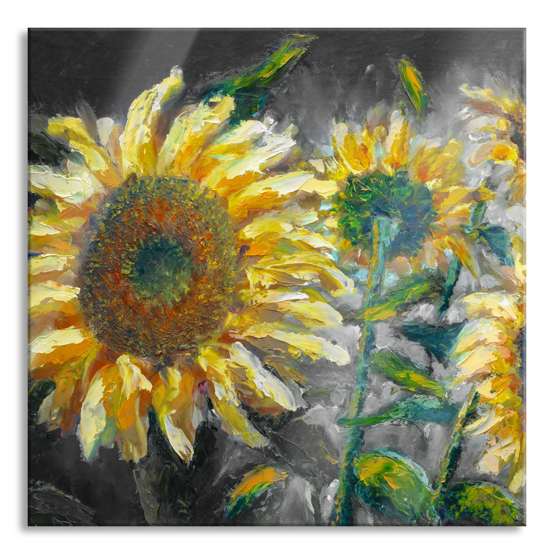 Glasbild Sonnenblumen vor blauem Hintergrund