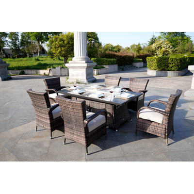Omied 6 - Person Patio Dining Set Rectangular Table with Cushions Included