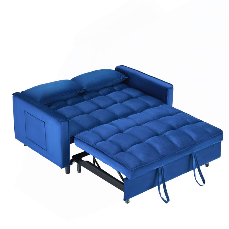 Le canapé en velours bleu onirique de 55 po est élégant et pratique avec des poches, interprétant habilement l'art de la conversion trois-en-un.