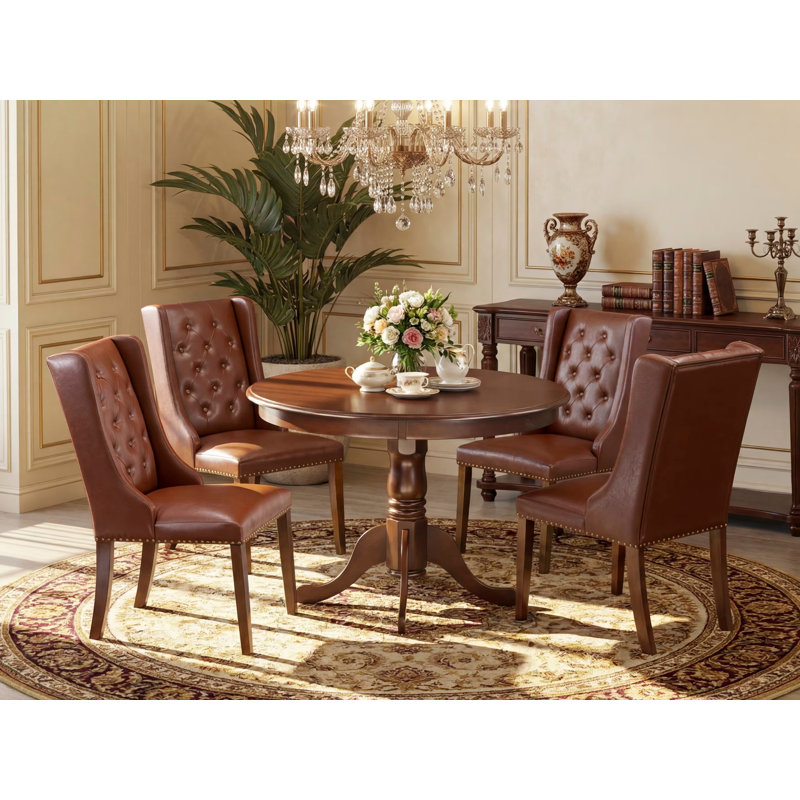 L'ensemble de table de cuisine 5 pièces pour 4 personnes comprend une table de salle à manger ronde avec piédestal et 4 chaises Parson en simili cuir brun, acajou