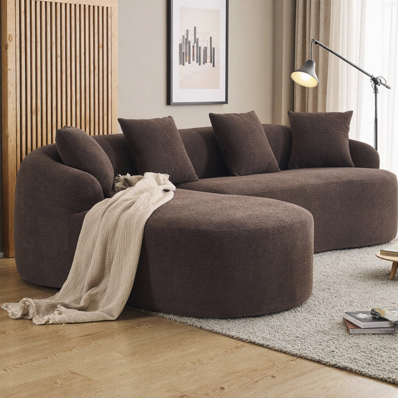 Canapé d'angle modulaire avec accoudoirs plus larges, assise plus profonde et dossier surélevé pour plus de confort et de style