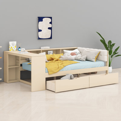 Le lit plateforme avec tablettes de rangement, tiroirs et station de charge offre une tête de lit rembourrée et une organisation intégrée pour toute chambre à coucher