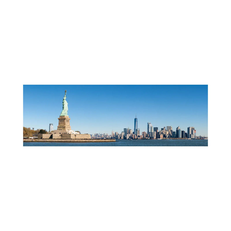 Statue Of Liberty In Front Of The Manhattan Skyline by Jan Becke - Wrapped Canvas Panoramic Print