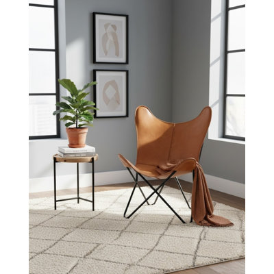 Fauteuil papillon brun clair