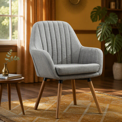 Fauteuil d'appoint contemporain en tissu alliant confort, style et durabilité pour un espace de vie moderne et invitant