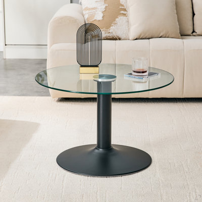 Table basse ronde en verre trempé de 27,5 pouces de diamètre. 17,7 pouces de haut, soutenu par une base en métal noir, avec un bord de luxe léger.