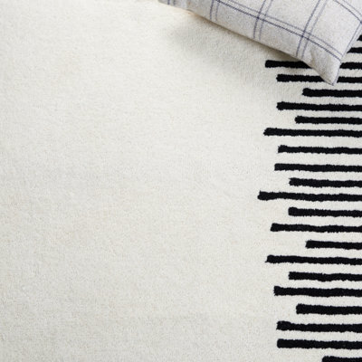 Tapis ivoire / noir Anaee Fifth Avenue 129