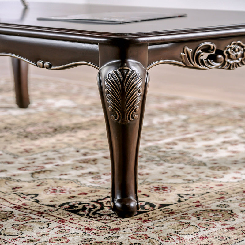 Table basse de style traditionnel avec pieds courbés et structure sculptée en bois massif Java