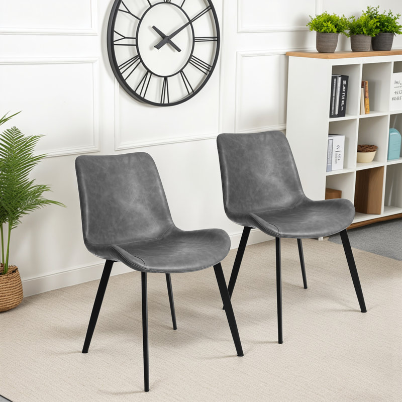 Chaises de salle à manger modernes en similicuir, chaises latérales sans accoudoirs avec dossier incurvé et pieds fuselés en métal noir, revêtement en similicuir, supportant jusqu'à 300 lb