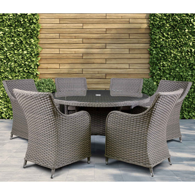 Cynthis 6 - Person Wicker Patio Dining Set with Round Table , Cushions Included