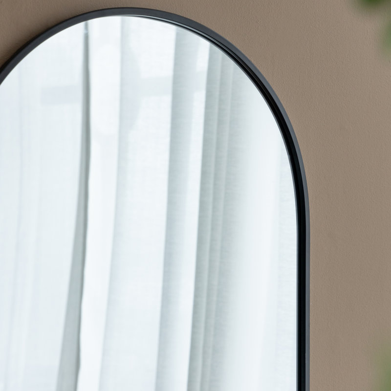 Miroir arqué noir avec cadre en métal
