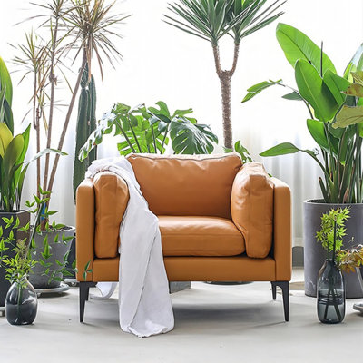 Chaise avec accoudoirs coussinée orange en cuir véritable