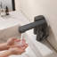Robinet de salle de bain moderne sans contact avec distributeur de savon intégré, affichage numérique de la température-130085757