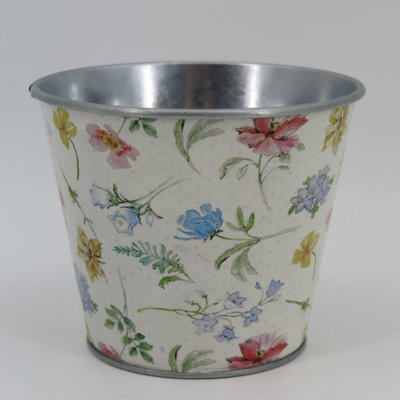 Spring Flowers On White Metal Planter