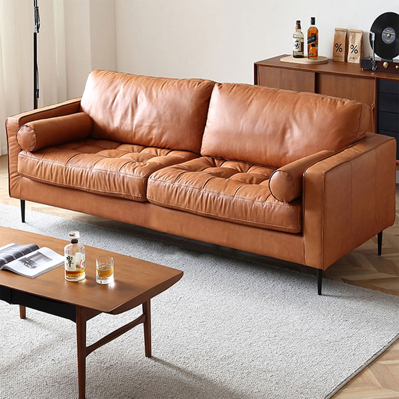 Causeuse coussin orange en cuir véritable, H 33,46 po x l 82,68 po x P 35,43 po