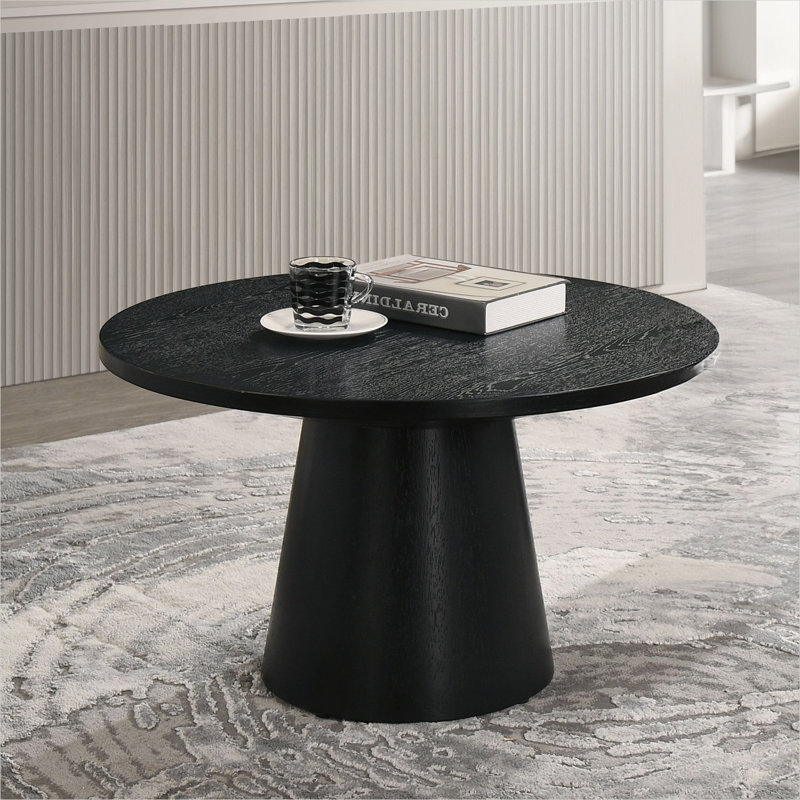 Table basse ronde de couleur noire avec base à piédestal conique, style moderne et contemporain pour le salon