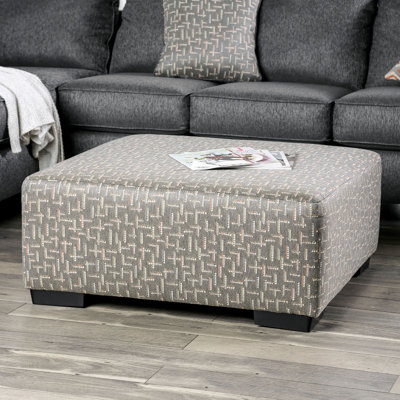 Repose-pieds gris avec coussins carrés et mousse à densité moyenne