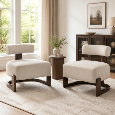 Fauteuil lounge Solven de style moderne du milieu du siècle, sans accoudoirs, avec piètement en bois courbé et coussin de dossier cylindrique, idéal pour le salon ou le coin lecture.
