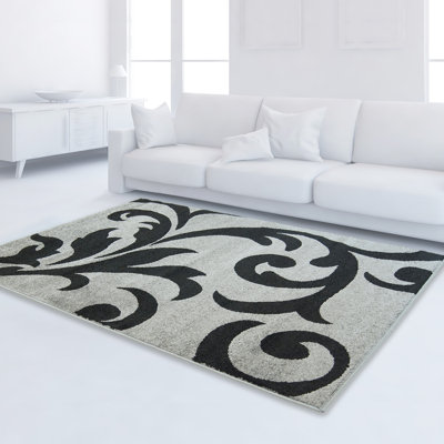 Tapis à motif floral gris / noir