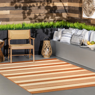 Tapis rayé intérieur / extérieur pour terrasse de salon Haydon, terre cuite / ivoire
