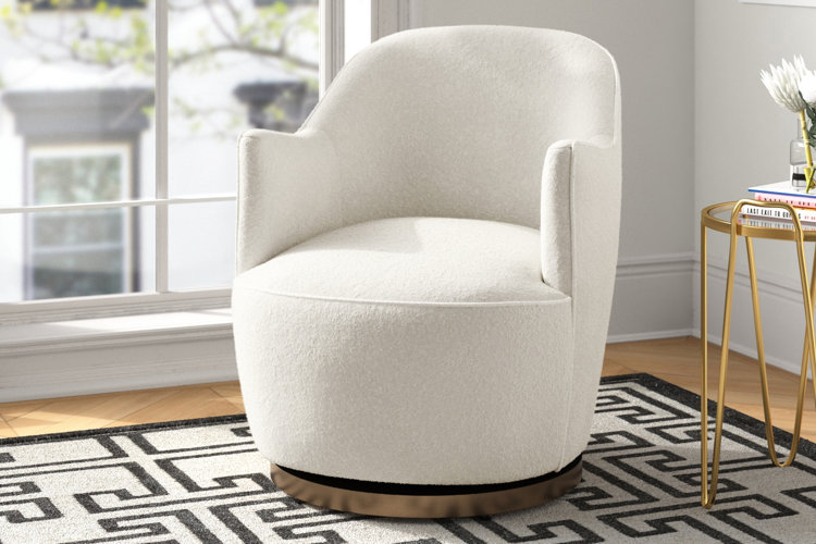 glam living room with a swiveling boucle accent chair