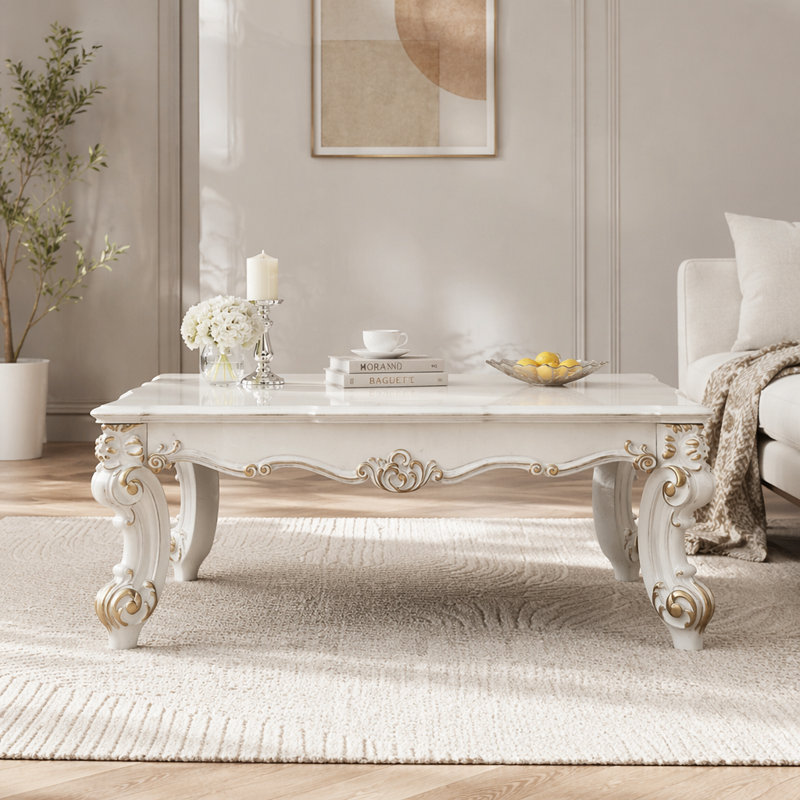 Table basse avec pieds à volutes Pearl