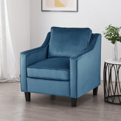 Fauteuil club en velours bleu