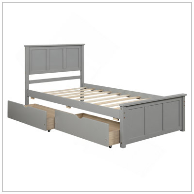 Lit plateforme peu encombrant avec lit gigogne, structure en bois robuste, idéal pour les chambres compactes et les chambres d'amis.