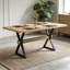 Élégante table de salle à manger à pieds en X avec une fabrication durable et une surface spacieuse, parfaite pour les réunions de famille et les intérieurs modernes.-150598985