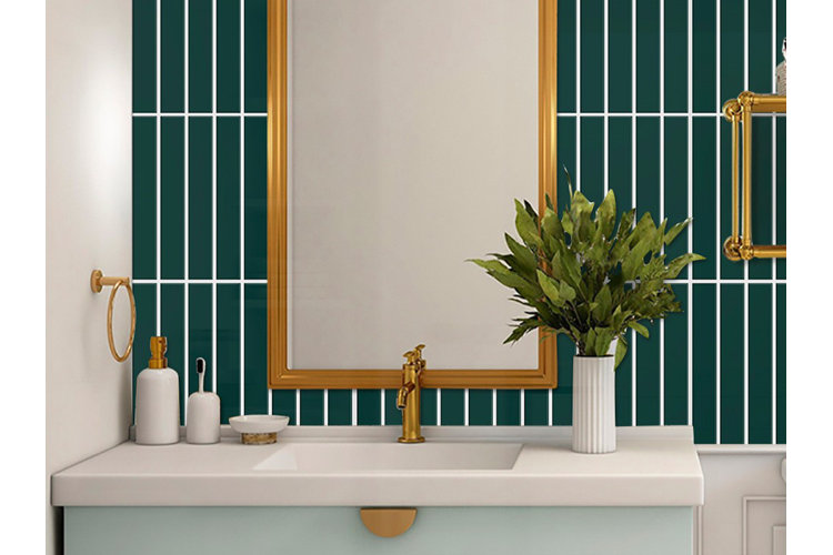 deep green rectangular peel-and-stick backsplash tile above the sink in a clean and modern bathroom