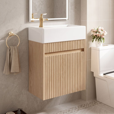 Meuble-lavabo mural de 47 cm (18,5 po) avec lavabo réversible en résine et porte à ouverture par simple pression pour les espaces compacts