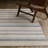 Goulart Textural Geometric Striped Ivory/ Multi Area Rug-1888268688