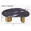 Table basse ovale (1 pièce): plateau en pierre frittée, pieds dorés, bords d'angle doux, finition noir gris et or mat, idéal pour les salons principaux