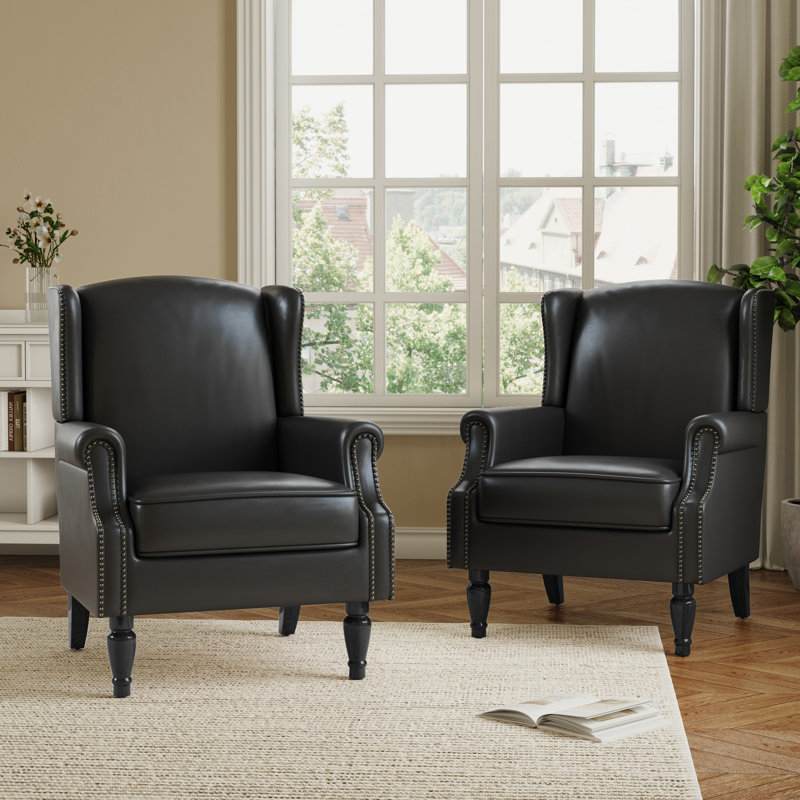 Fauteuil à oreilles en similicuir noir rembourré avec garniture cloutée Duward, Similicuir noir