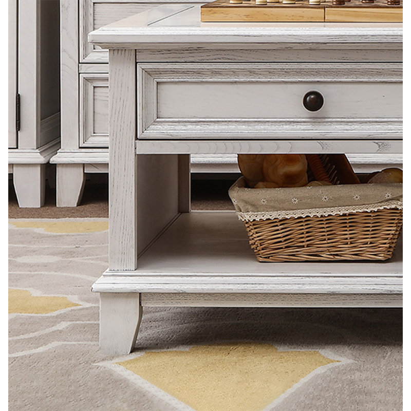 Four-drawer coffee table in solid white wood., 20.08" H x 49.21" L x 27.95" W