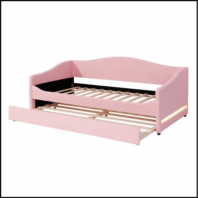 Upholstered Daybed with Integrated Light and Trundle for Extra Sleeping Space, Perfect for Modern and Elegant Living Spaces.