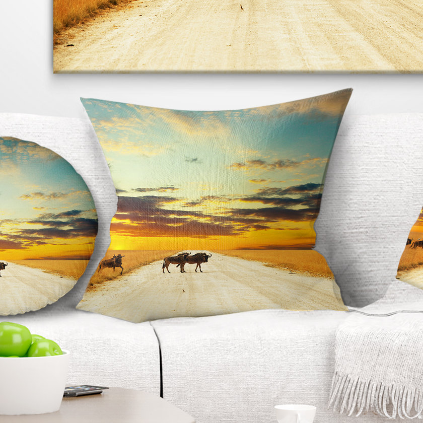 Design Art African Wildebeests Crossing Path in Evening Pillow | Wayfair
