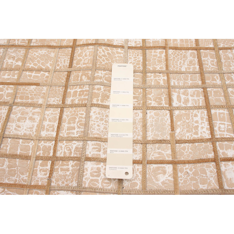 Tapis décoratif en cuir beige fabriqué à la main géométrique