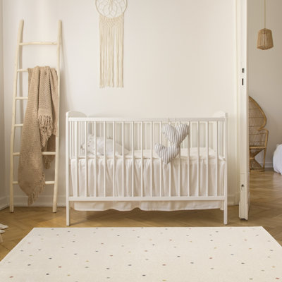 Tapis blanc à pois multicolores