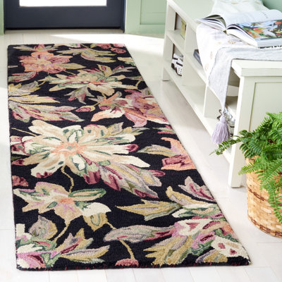 Kamaar Hand Tufted Wool/Cotton Floral Rug in Black/Plum