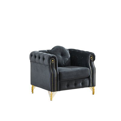Canapé Chesterfield en velours avec coussins ronds, avec des clous en cuivre et des boutons capitonnés, avec des pieds en métal. La conception en boucle permet de suspendre des ornements de dessins animés.
