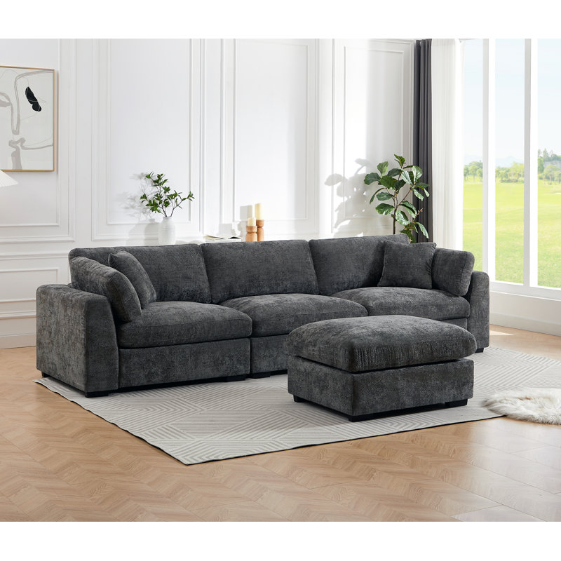 Aariketh 130.87”Wide Upholstered Loose Back Modular Sectional Sofa with Large Ottoman, Dark Grey Polyester