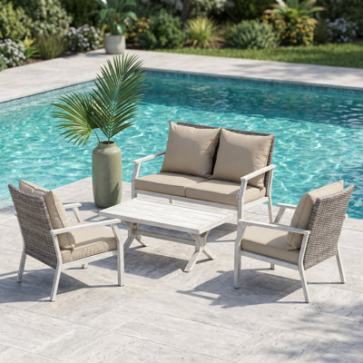 Ensemble de conversation 4 pièces en osier d'extérieur beige avec coussins et table basse - parfait pour le jardin, la piscine ou le patio