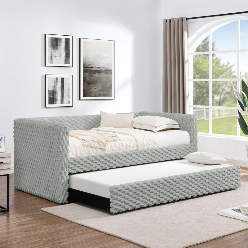 Lit de jour simple rembourré avec couchette escamotable, port de chargement USB et poches de rangement latérales pour une vie moderne.