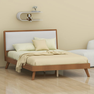 Bed frame with ergonomic angled headboard and splayed legs, mid-century modern style with under-bed clearance