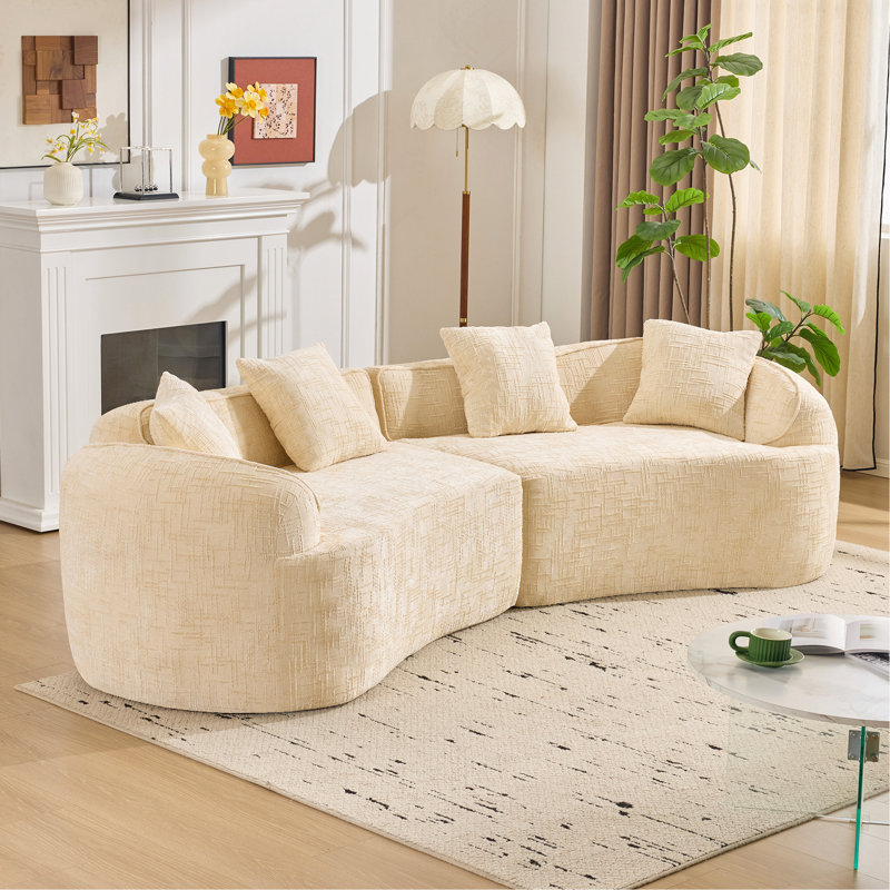 Canapé beige courbé et compressé, conception créative de style nordique pour le salon, confortable, doux et adapté à de multiples cas de figure